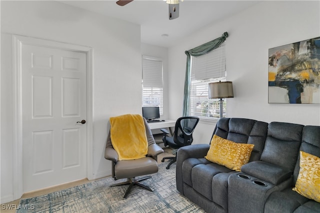 living room with hardwood / wood-style flooring and ceiling fan