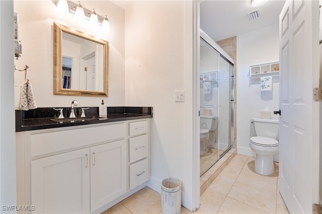 bathroom featuring walk in shower, tile patterned flooring, vanity, and toilet