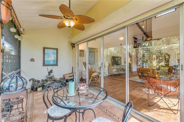 sunroom / solarium with vaulted ceiling and ceiling fan