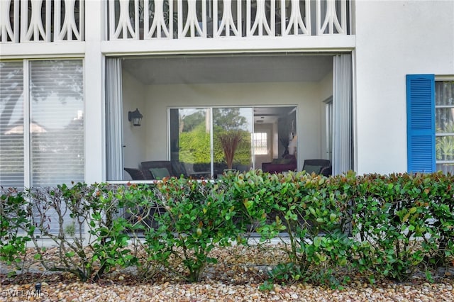 750 Mooring Line Dr Unit 105, Naples, FL 34102 - doorway to property featuring stucco siding
