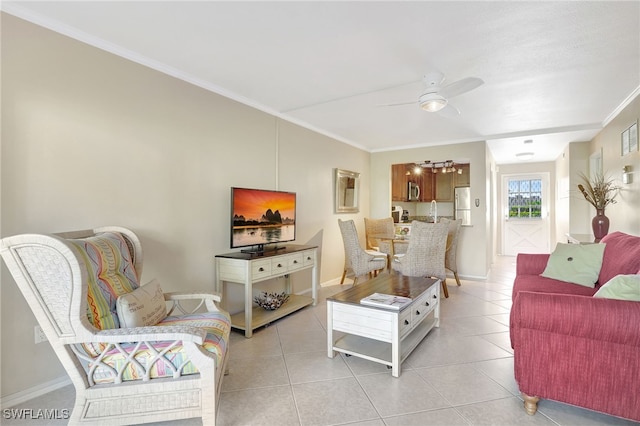 750 Mooring Line Dr Unit 105, Naples, FL 34102 - living room with ornamental molding, a ceiling fan, light tile patterned floors, and baseboards