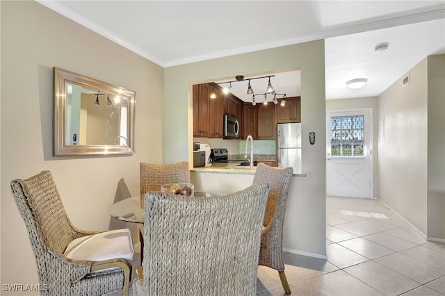 750 Mooring Line Dr Unit 105, Naples, FL 34102 - dining space with light tile patterned flooring, baseboards, and crown molding