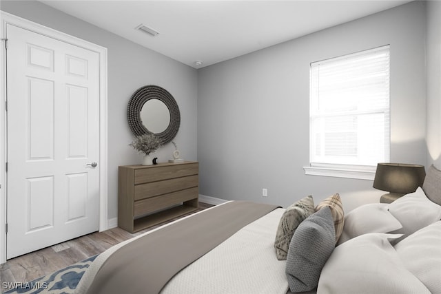 bedroom featuring light hardwood / wood-style floors