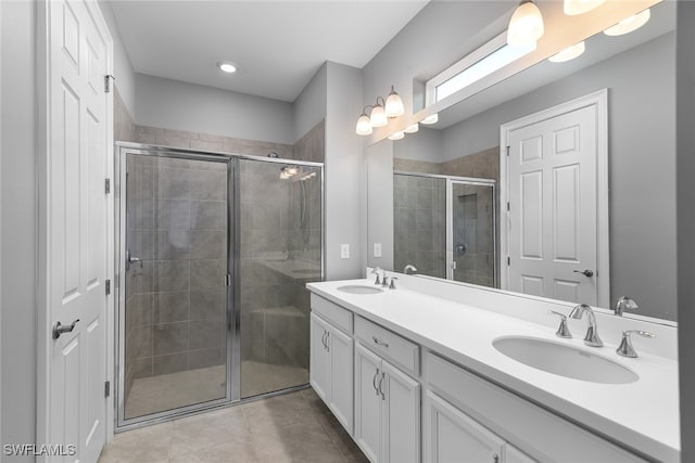 bathroom with vanity, tile patterned floors, and an enclosed shower