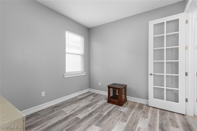 empty room with light hardwood / wood-style floors