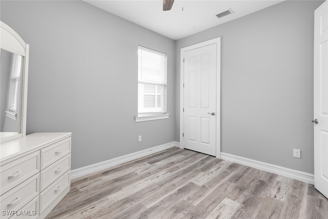 unfurnished bedroom featuring ceiling fan and light wood-type flooring