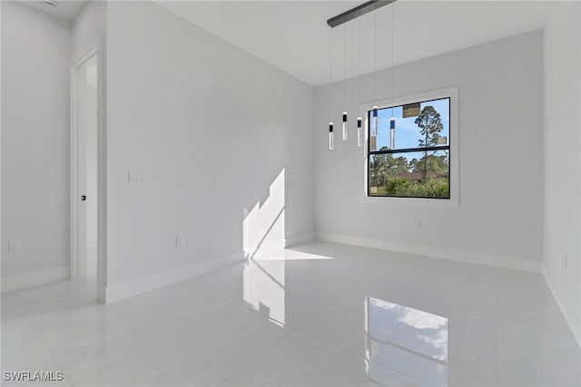 empty room featuring light tile patterned floors