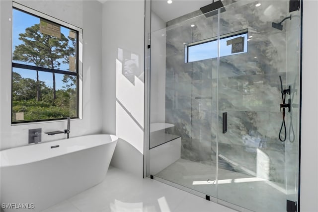 bathroom with independent shower and bath, tile patterned flooring, and plenty of natural light