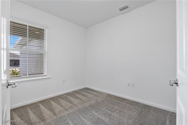 unfurnished room with carpet flooring