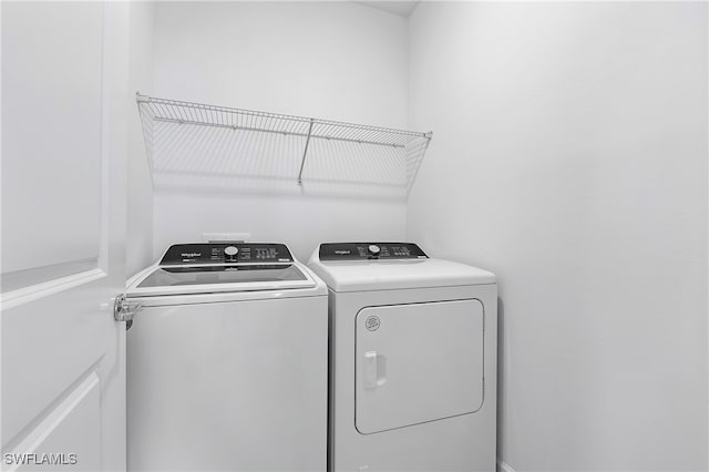 laundry room featuring washing machine and dryer