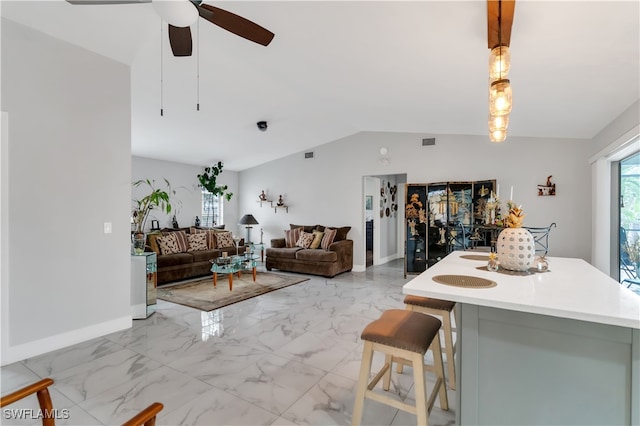 dining room with vaulted ceiling and ceiling fan