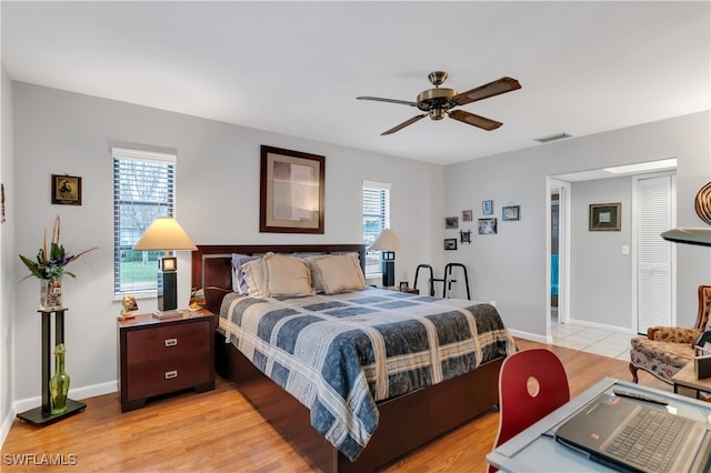 bedroom featuring ceiling fan and light hardwood / wood-style floors