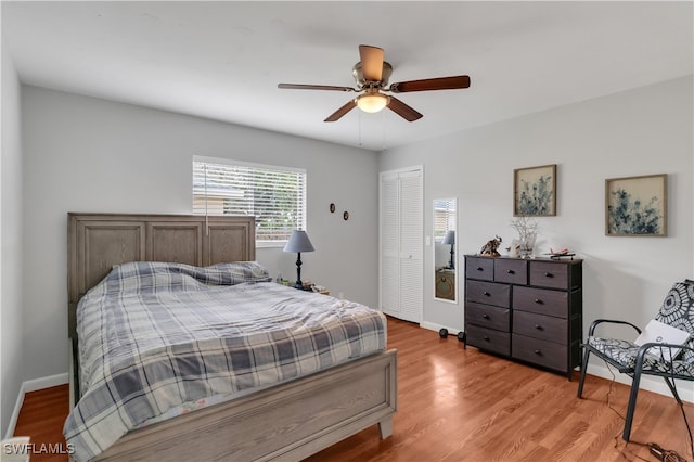 bedroom with ceiling fan, a closet, and light hardwood / wood-style floors