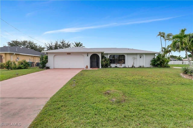 ranch-style house featuring a garage and a front yard