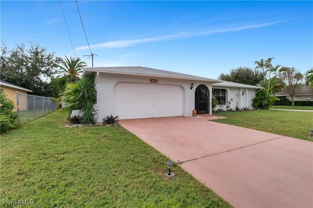 ranch-style home featuring a front yard and a garage