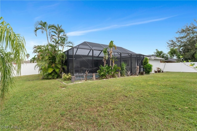 view of yard with a lanai and a pool