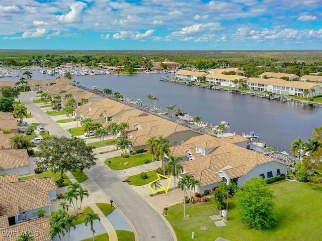 birds eye view of property featuring a water view