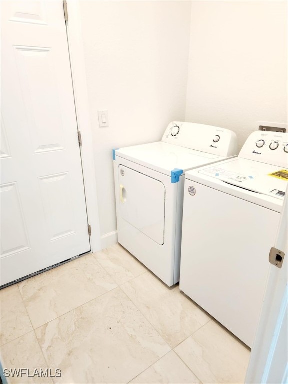 washroom featuring separate washer and dryer