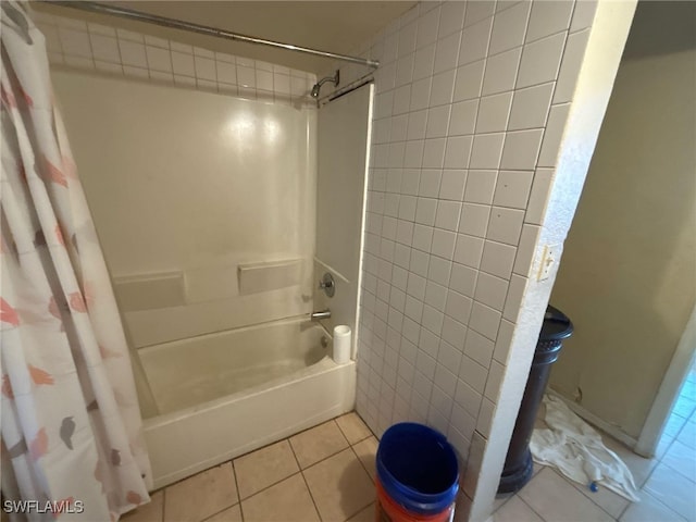 bathroom with tile patterned floors and shower / tub combo