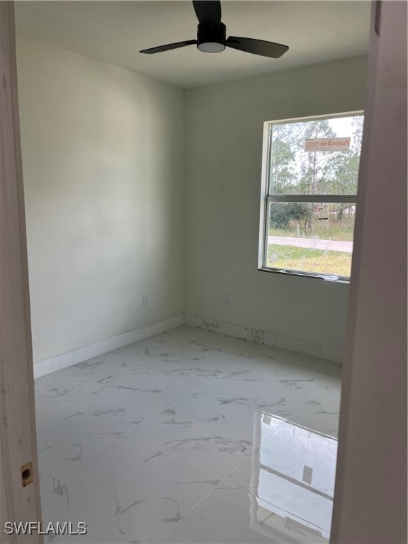 unfurnished room featuring ceiling fan