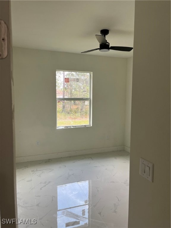 empty room featuring ceiling fan