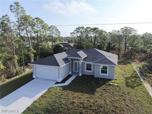 view of front facade with a front lawn and a garage