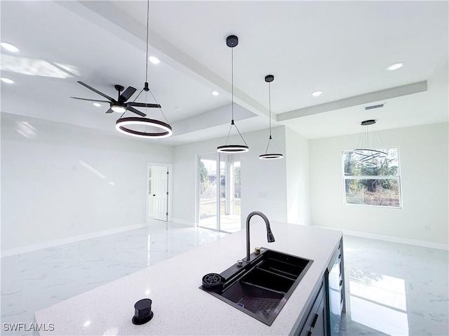 kitchen with decorative light fixtures, sink, stainless steel dishwasher, ceiling fan, and beamed ceiling