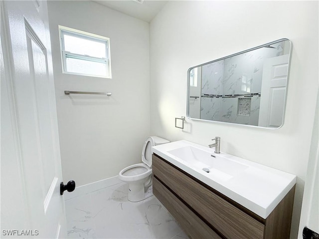 bathroom featuring toilet and vanity