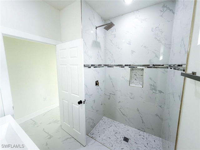 bathroom featuring a tile shower