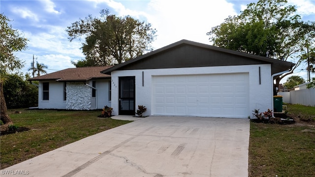 single story home featuring a garage and a front lawn