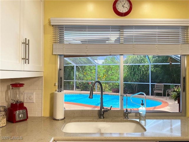 view of pool with sink