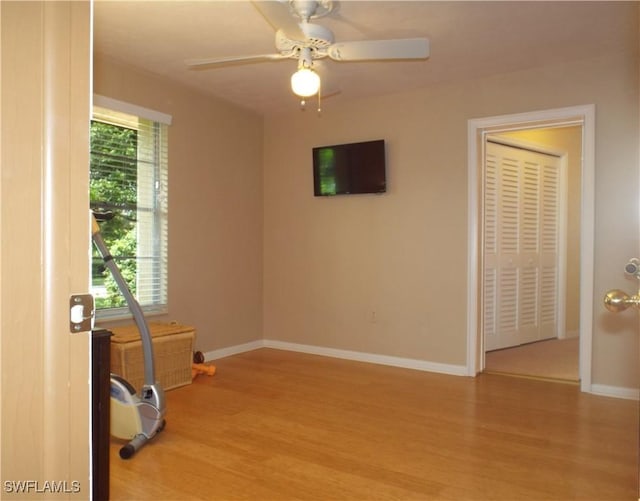 spare room featuring ceiling fan and light wood-type flooring