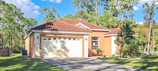 mediterranean / spanish-style home with a garage, a tile roof, a front yard, driveway, and stucco siding