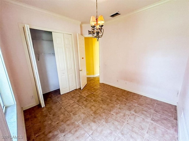 unfurnished bedroom with crown molding, a chandelier, a closet, baseboards, and light tile patterned flooring