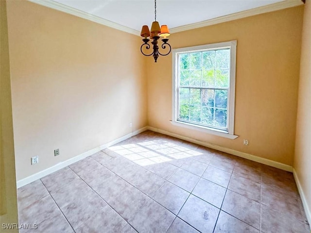 empty room featuring ornamental molding, a chandelier, baseboards, and tile patterned flooring
