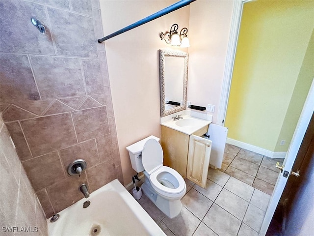 full bathroom featuring toilet, vanity, tile patterned floors, and tiled shower / bath