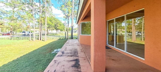 view of side of property featuring a lawn