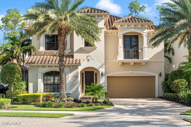 mediterranean / spanish house featuring a garage