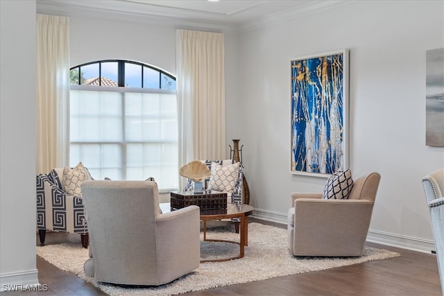 sitting room featuring dark hardwood / wood-style flooring and ornamental molding