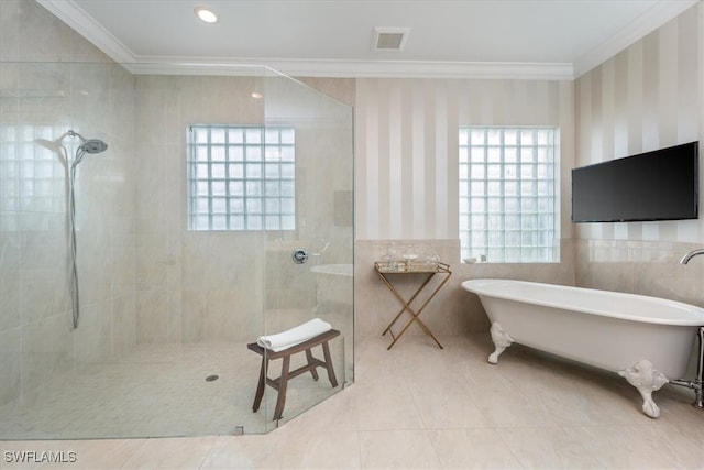 bathroom featuring ornamental molding, tile patterned floors, tile walls, and independent shower and bath