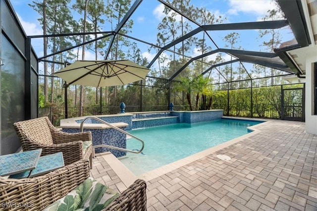 outdoor pool with glass enclosure and a patio