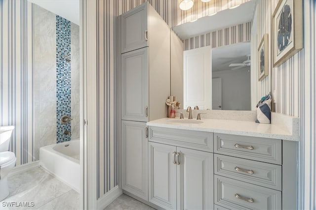 bathroom featuring vanity, ceiling fan, and toilet