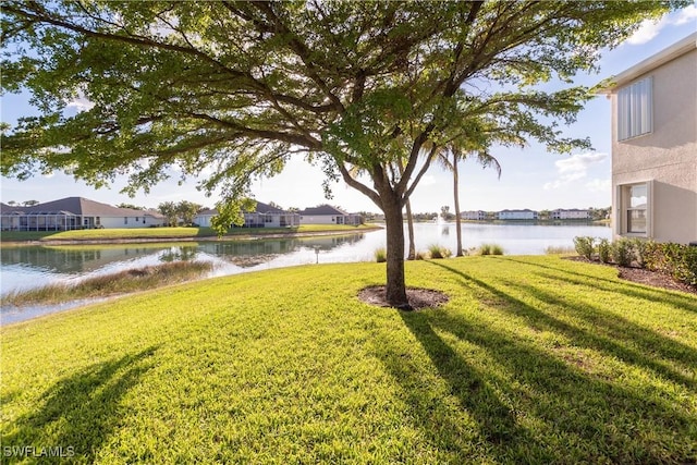 view of yard with a water view and a residential view