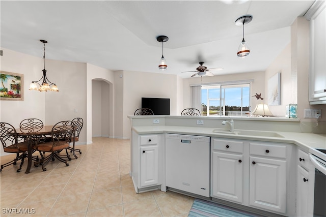 kitchen with white dishwasher, ceiling fan with notable chandelier, white cabinets, sink, and light tile patterned floors