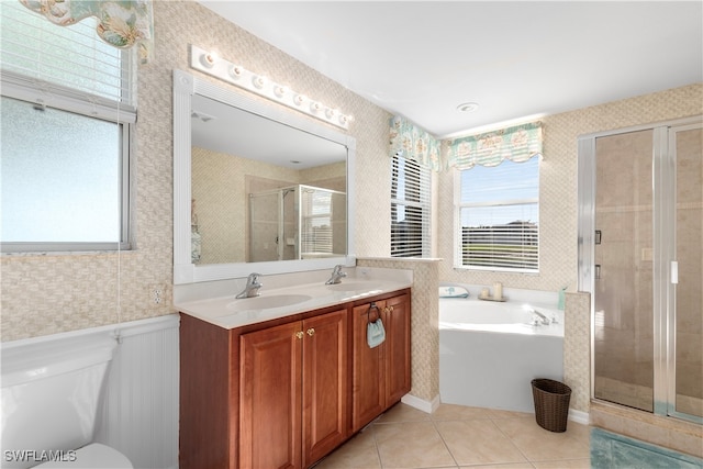 full bathroom with tile patterned floors, toilet, vanity, and shower with separate bathtub