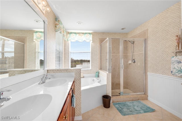 bathroom featuring tile patterned floors, vanity, and plus walk in shower