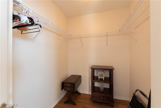 walk in closet featuring hardwood / wood-style flooring