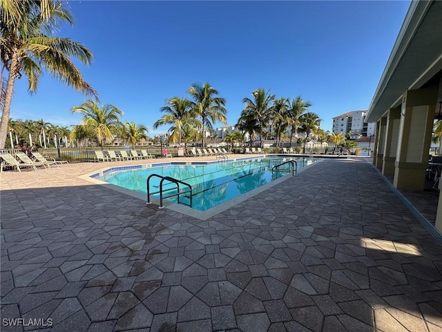 view of swimming pool with a patio