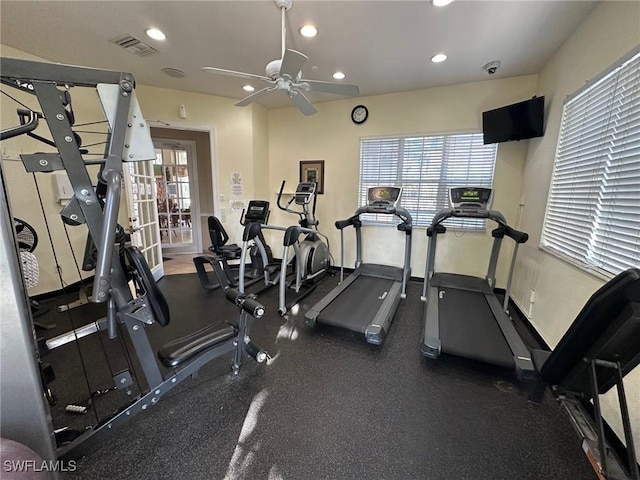 exercise room with ceiling fan and a healthy amount of sunlight