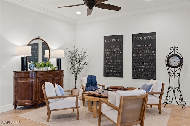 living area with light tile patterned flooring, ceiling fan, and ornamental molding